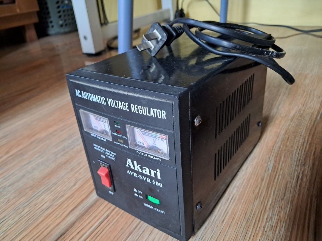 Akari AVR-SVR 500 AC Automatic Voltage Regulator (Category: Electrical, Adaptors & Sockets) located in Makati City. Submitted by Titan (Listing ID 1466223871, Image 2). Description: Akari AVR-SVR 500 automatic voltage regulator. Handles input voltage from 200-260 VAC. Outputs 220VAC and 110VAC. Multiple outlet ports on the back with separate 110V and 220V sockets plus fuse protection. Front panel includes dual analog voltage meters, main power sw