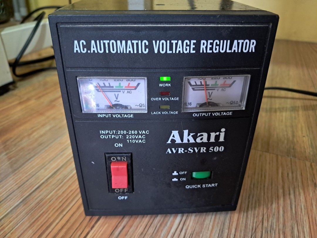 Akari AVR-SVR 500 AC Automatic Voltage Regulator (Category: Electrical, Adaptors & Sockets) located in Makati City. Submitted by Titan (Listing ID 1466223871, Image 1). Description: Akari AVR-SVR 500 automatic voltage regulator. Handles input voltage from 200-260 VAC. Outputs 220VAC and 110VAC. Multiple outlet ports on the back with separate 110V and 220V sockets plus fuse protection. Front panel includes dual analog voltage meters, main power sw