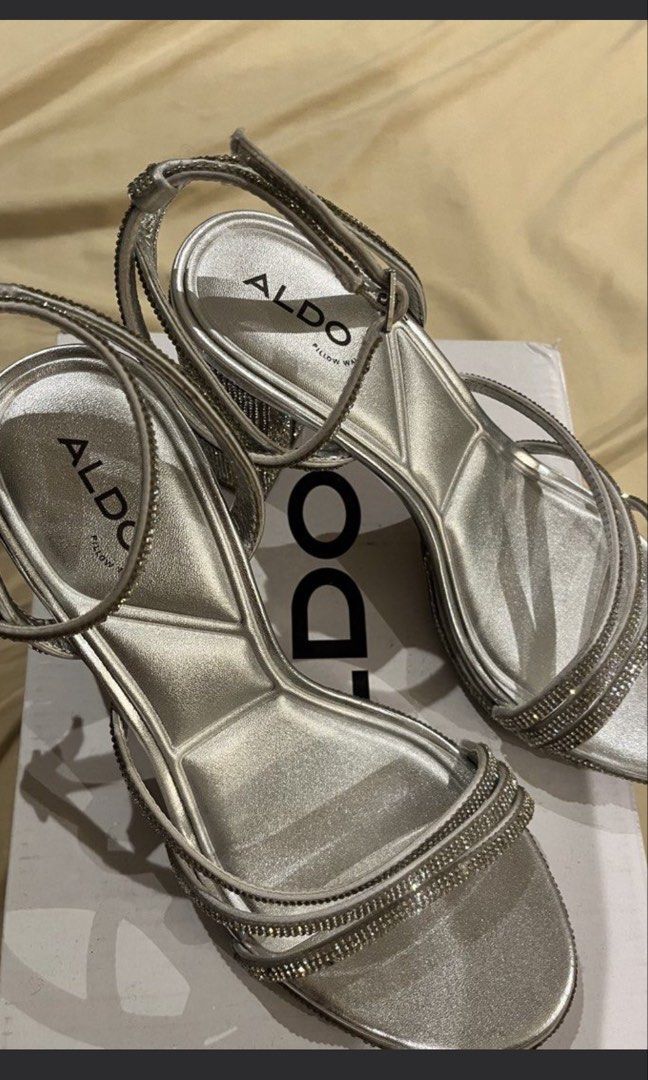 ALDO Silver Rhinestone Block Heels (Category: Heels) located in Las Pinas. Submitted by francesaly (Listing ID 1466316499, Image 1). Description: - Brand: ALDO - Style: Silver rhinestone block heels with a strappy front design - Features: Adjustable ankle strap and fully rhinestone-covered block heel for extra sparkle - Inclusion: Original box included.
