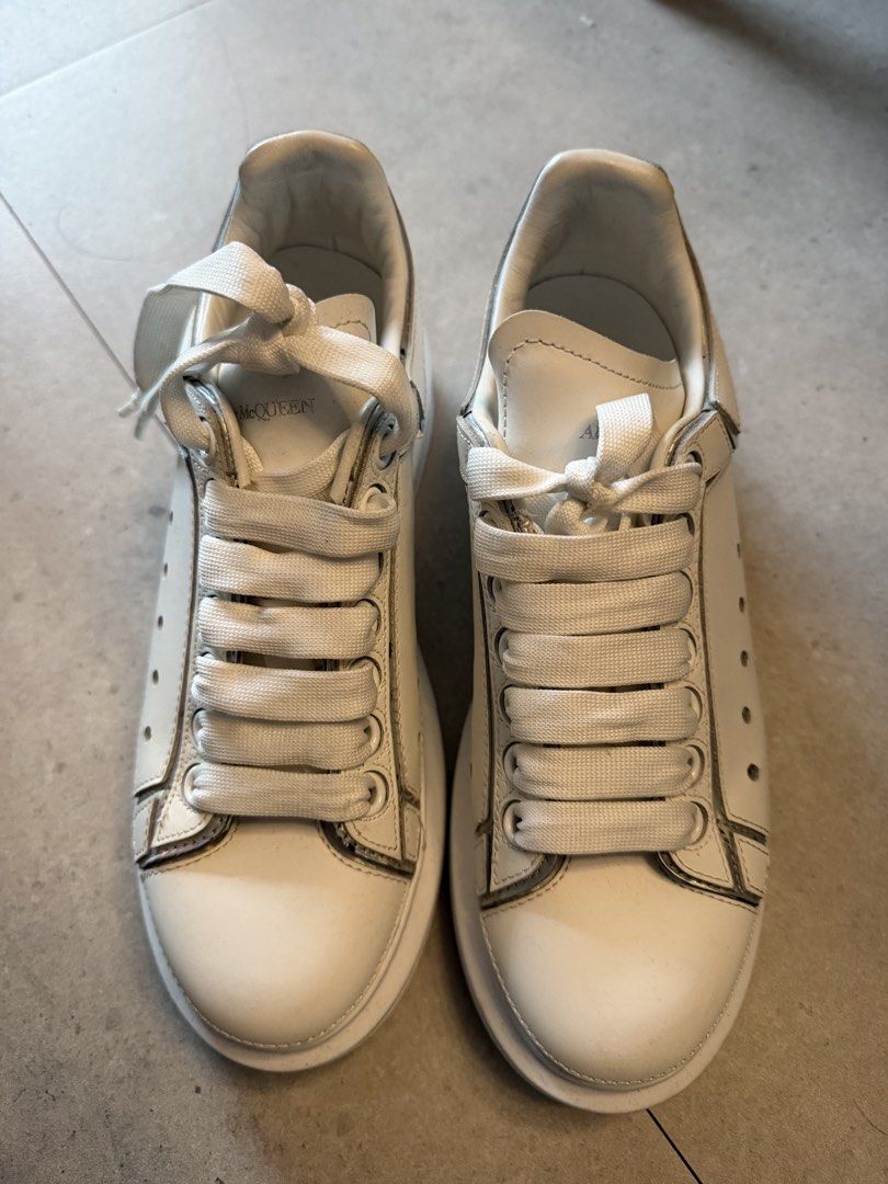 ORIGINAL Alexander McQueen Oversized lace-up sneakers (Category: Sneakers) located in San Juan City. Submitted by LuckyFindsPh (Listing ID 1466183748, Image 1). Description: You are looking at an authentic Alexander McQueen Pre-Owned Oversized lace-up sneakers. Highlights * white * leather * front lace-up fastening * round toe * oversized rubber sole * perforated details * Condition: VERY GOOD. This previously owned and used item is in good condi