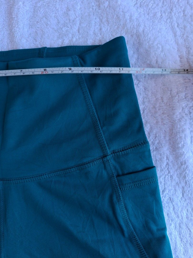 ALL IN MOTION HIGH RISE SHORT WITH POCKETS (Category: Activewear) located in Abucay. Submitted by petiteprettyboutiquev2 (Listing ID 1466180555, Image 2). Description: High-waisted athletic biker shorts in a dark teal or blue-green shade featuring convenient side pockets + SF(J&T).