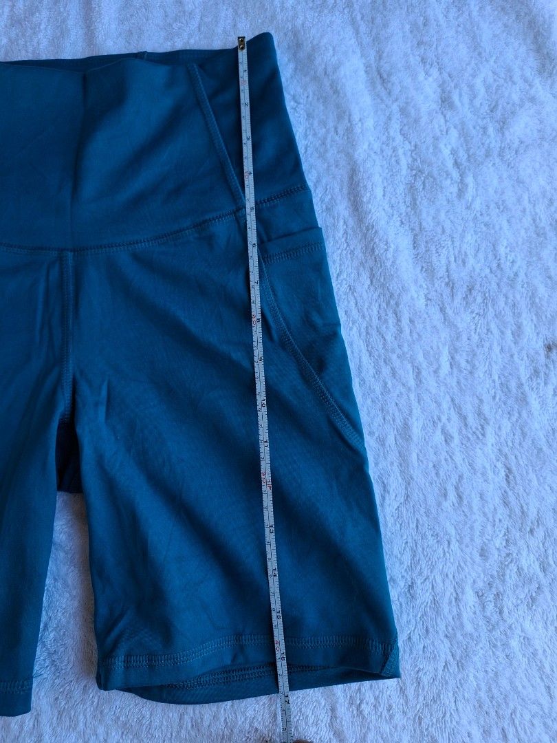 ALL IN MOTION HIGH RISE SHORT WITH POCKETS (Category: Activewear) located in Abucay. Submitted by petiteprettyboutiquev2 (Listing ID 1466180555, Image 3). Description: High-waisted athletic biker shorts in a dark teal or blue-green shade featuring convenient side pockets + SF(J&T).