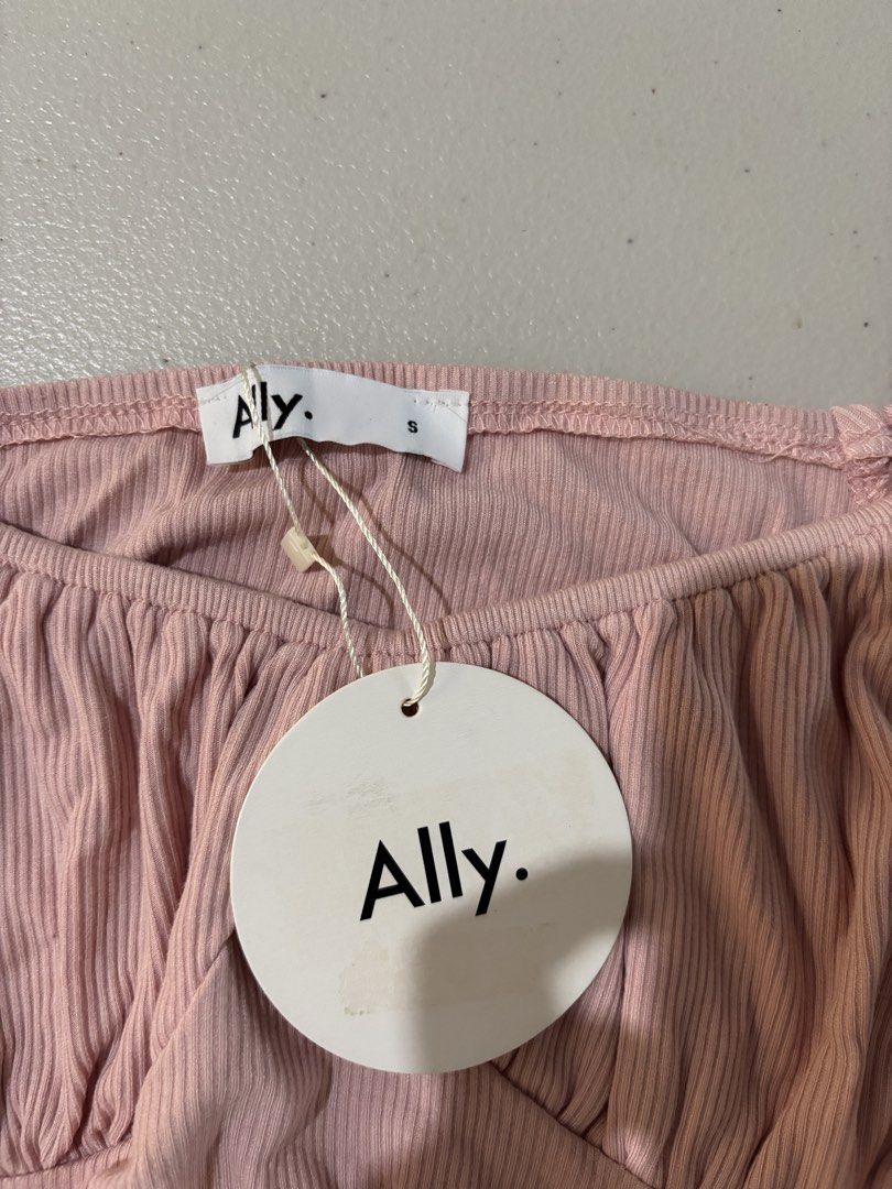 Ally Pink Ribbed Off-Shoulder Top (Category: Sleeveless) located in Guimba. Submitted by huenited (Listing ID 1466218115, Image 2). Description: - Brand: Ally - Condition: Brand new with tags (BNWT) - Size: Small - Color: Pink - Details: Ribbed fabric, square neckline, ruched front, short puff sleeves, and adjustable side drawstrings.