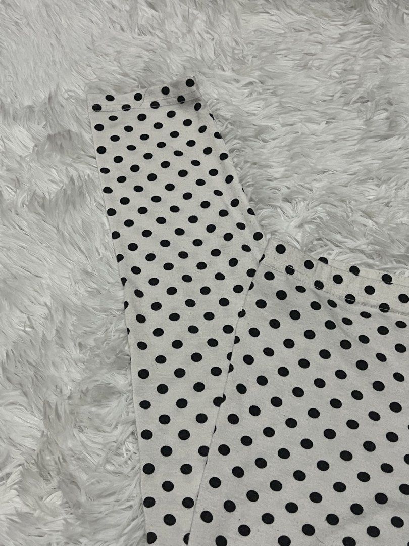 ALM Polka Dot Leggings (Category: Activewear) located in Tuguegarao City. Submitted by love_clothies (Listing ID 1466157880, Image 3). Description: - Brand: ALM - Pattern: Black and white polka dot - Fit: Snug, comfortable, with a secure elastic waistband - Material: Stretchy and flexible fabric - Best for: Casual days, workouts, or lounging - Styling: Pairs easily with solid-colored tops.