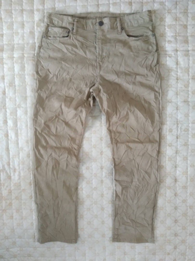 American Eagle Beige Khaki Pants Trousers (Category: Chinos) located in Zamboanga. Submitted by nurbya898048 (Listing ID 1466259619, Image 1). Description: - Brand: American Eagle - Style: Classic five-pocket khaki trousers - Color: Neutral beige - Details: Button closure, belt loops, and leather brand patch on the back waistband - Condition: Good, but needs a quick iron due to storage wrinkles - Versatility: Easy to pair with both t-shirts and b