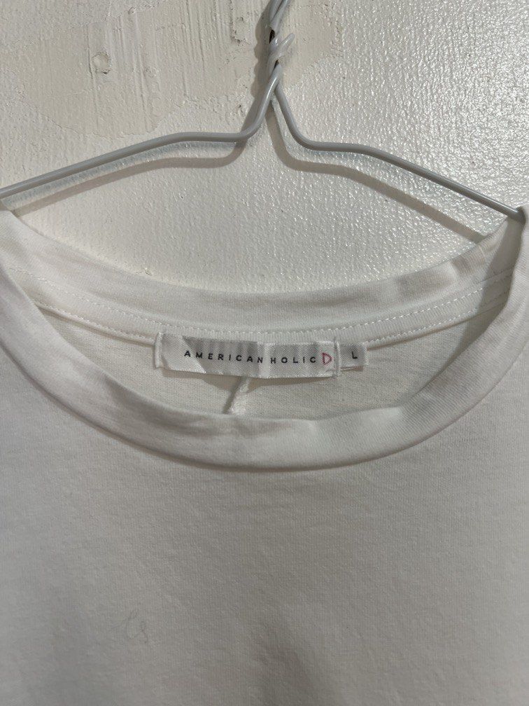 American Holic L size shirt (Category: Shirts) located in Las Pinas. Submitted by gaeley (Listing ID 1466177305, Image 2). Description: super white stylish L on tag b: 23" armpit to armpit l: 24".