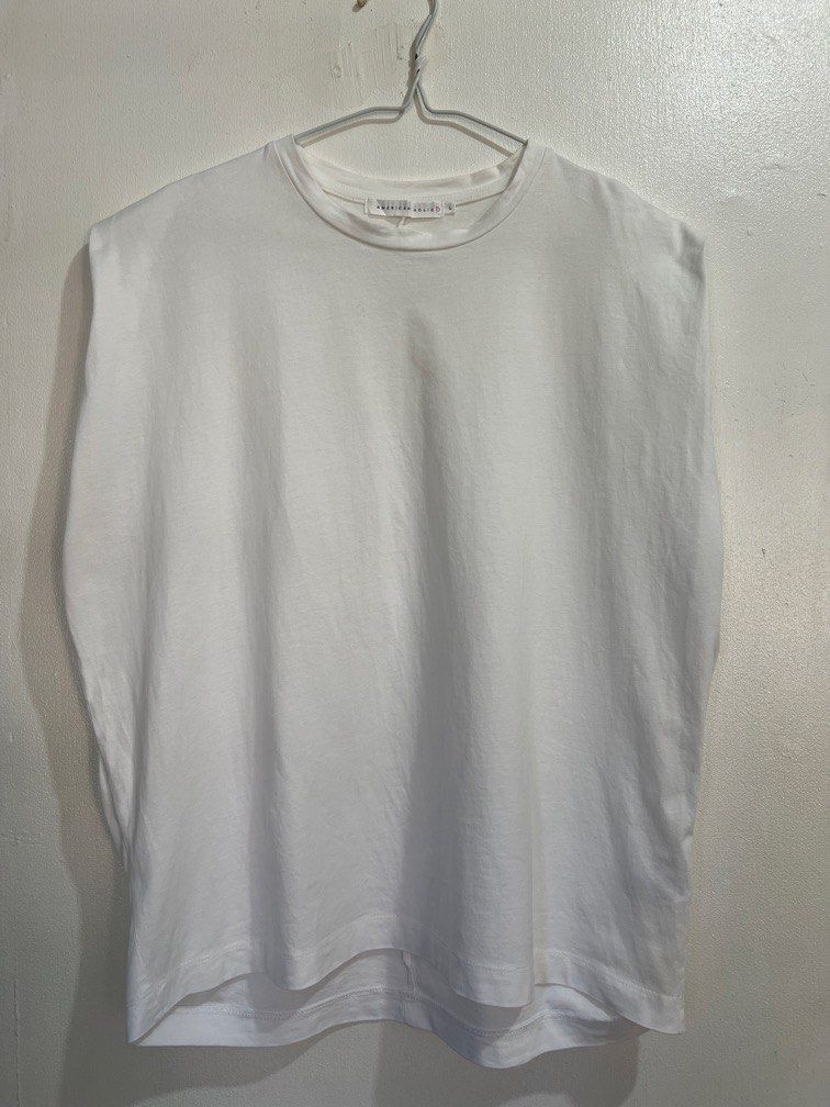 American Holic L size shirt (Category: Shirts) located in Las Pinas. Submitted by gaeley (Listing ID 1466177305, Image 1). Description: super white stylish L on tag b: 23" armpit to armpit l: 24".
