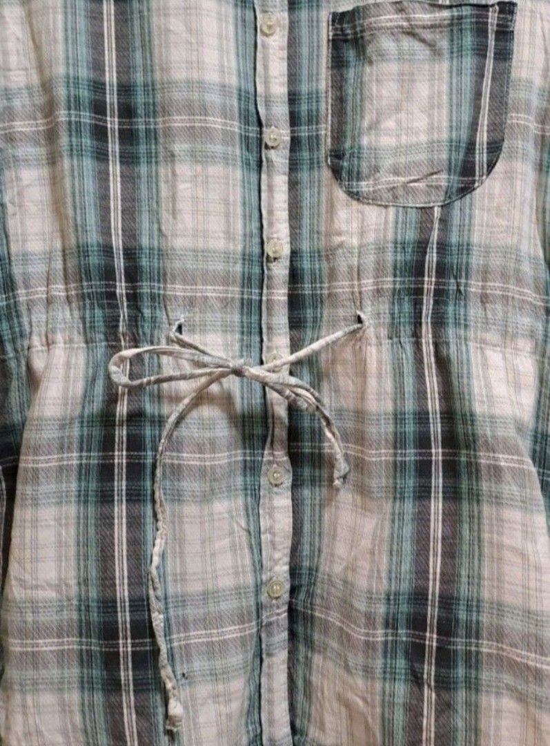 American Rag Checkered Blouse (Category: Blouses) located in Manila. Submitted by thrifter_lifestyle (Listing ID 1466156788, Image 3). Description: Brand: American Rag (bought in the US) 3/4 sleeve Oversize style, fall beyond waist when worn With front chest pocket Has drawstring in waist area Can fit a medium size 100% Cotton (see tag) Actual Color: Checkered Green, Black and Gray No issues 😀 RFS: Shifted to WFH, no need for office/business clo