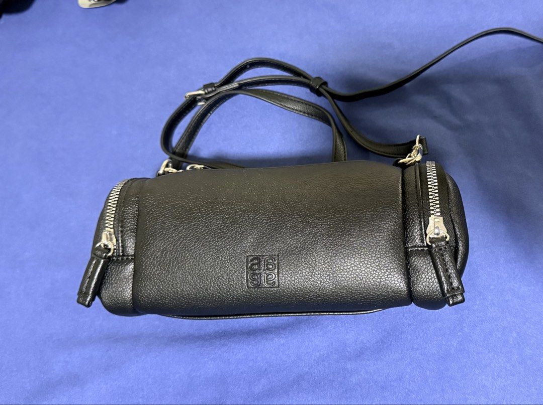 anello CHERISH Mini Shoulder Bag AGB5035 Black (Category: Shoulder Bags) located in Dasmarinas. Submitted by toyang50 (Listing ID 1466178681, Image 1). Description: Authentic anello CHERISH mini shoulder bag in black faux leather. Features a stylish barrel silhouette with dual side zippers, silver hardware, and an adjustable strap..