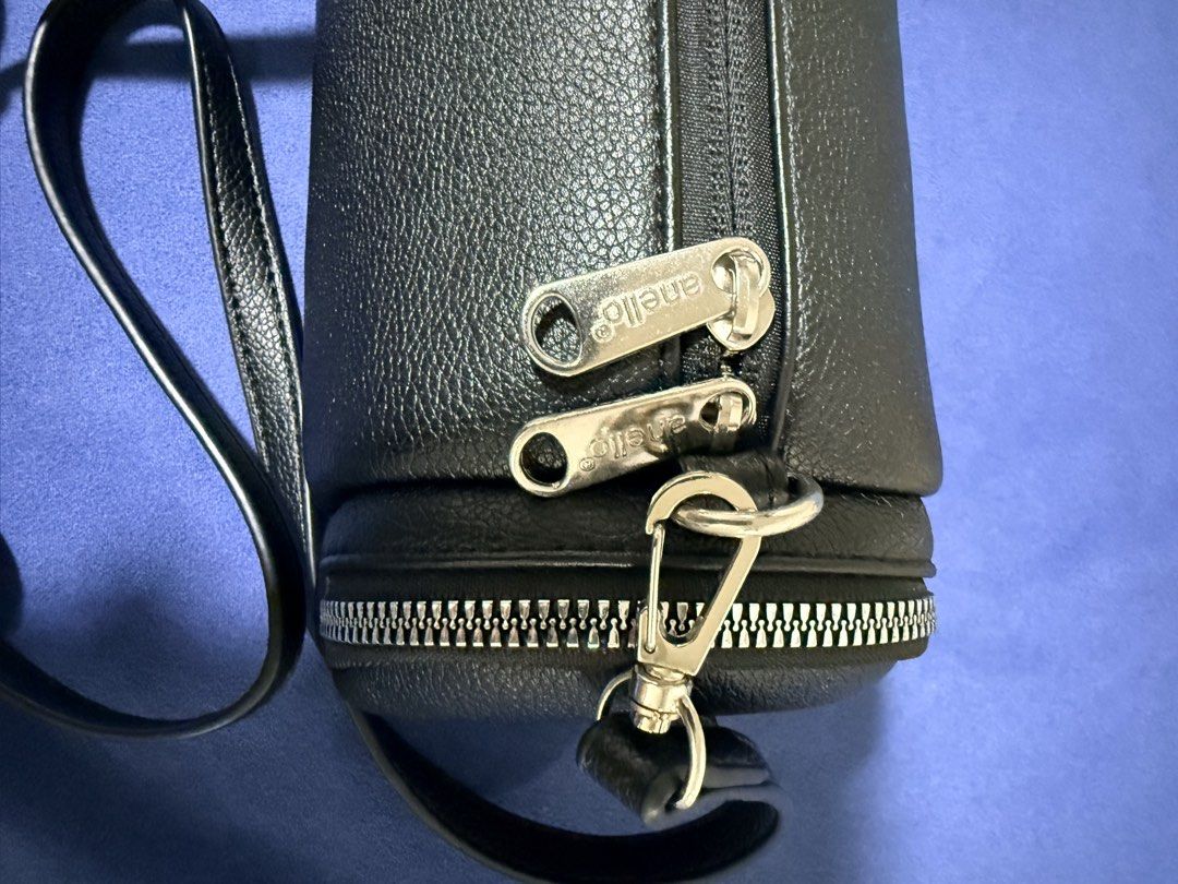 anello CHERISH Mini Shoulder Bag AGB5035 Black (Category: Shoulder Bags) located in Dasmarinas. Submitted by toyang50 (Listing ID 1466178681, Image 3). Description: Authentic anello CHERISH mini shoulder bag in black faux leather. Features a stylish barrel silhouette with dual side zippers, silver hardware, and an adjustable strap..