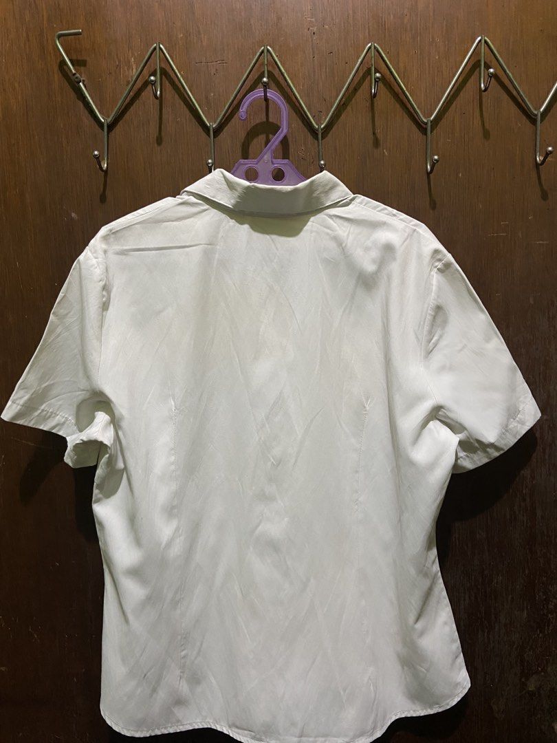 Anmumu White Short Sleeve Button Down Shirt Blouse (Category: Blouses) located in Borongan. Submitted by km_obsessed (Listing ID 1466300055, Image 2). Description: - Color: Clean solid white - Style: Short sleeve button-down with collared neckline - Fit: Fitted cut with side darts for a flattering silhouette - Fabric: Smooth, comfortable material - Versatility: Ideal for office wear, smart-casual looks, or everyday styling - Condition: Good stapl