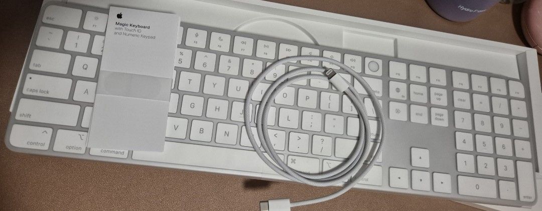 Apple Magic Keyboard with Touch ID and Numeric Keypad (Category: Computer Keyboard) located in Las Pinas. Submitted by g_tatamic (Listing ID 1466282504, Image 2). Description: Apple Magic Keyboard with Touch ID - complete with USB C - lightning cord and manual in its original box - rfs: no longer using it; decluttering - was never heavily used because i also have a mechanical keyboard.