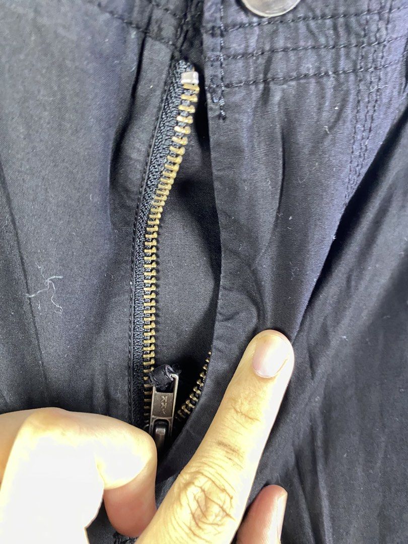 Armani Exchange Black Cargo Pants Size 32 (Category: Jeans) located in Manila. Submitted by declutterpromax (Listing ID 1466231654, Image 3). Description: - Brand: Armani Exchange - Size: 32 - Color: Black - Multiple utility pockets on legs - Adjustable drawstrings at the cuffs - Durable fabric with branded buttons and YKK zipper fly - Sturdy belt loops and reinforced stitching.
