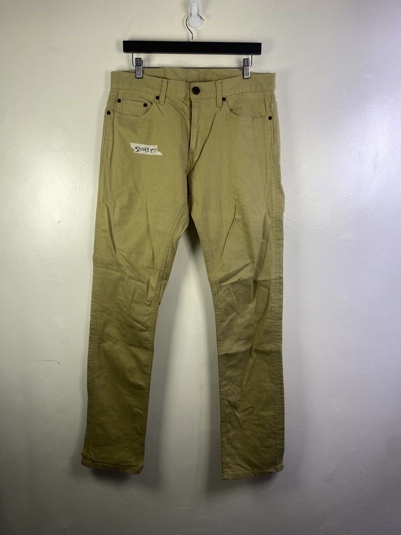 Armani Exchange Khaki Pants Size 32 (Category: Trousers) located in Manila. Submitted by declutterpromax (Listing ID 1466214036, Image 1). Description: - Brand: Armani Exchange - Size: 32 - Color: Versatile khaki / earth tone - Fit: Straight leg - Style: Classic five-pocket styling with zipper fly and button closure - Details: Branded label patch on the back waistband - Origin: Made in India.