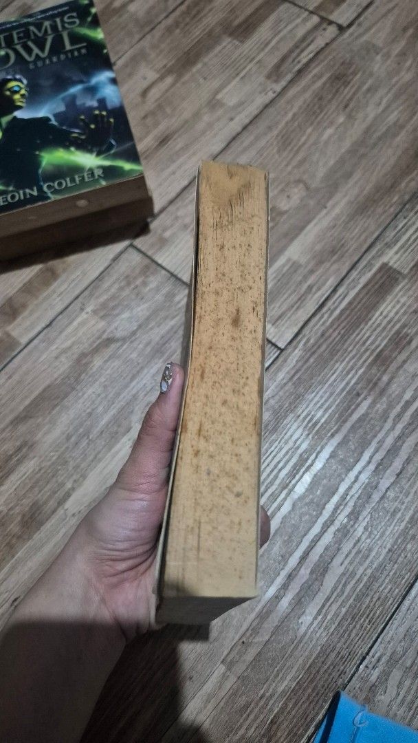 Artemis Fowl The Eternity Code Eoin Colfer paperback book (Category: Storybooks) located in Manila. Submitted by abianne (Listing ID 1466304354, Image 3). Description: - Title: Artemis Fowl: The Eternity Code by Eoin Colfer - Format: Paperback - Condition: Pages have age spots and yellowing; spine and cover are intact with normal shelf wear - Perfect for: Fans of fantasy and adventure books.