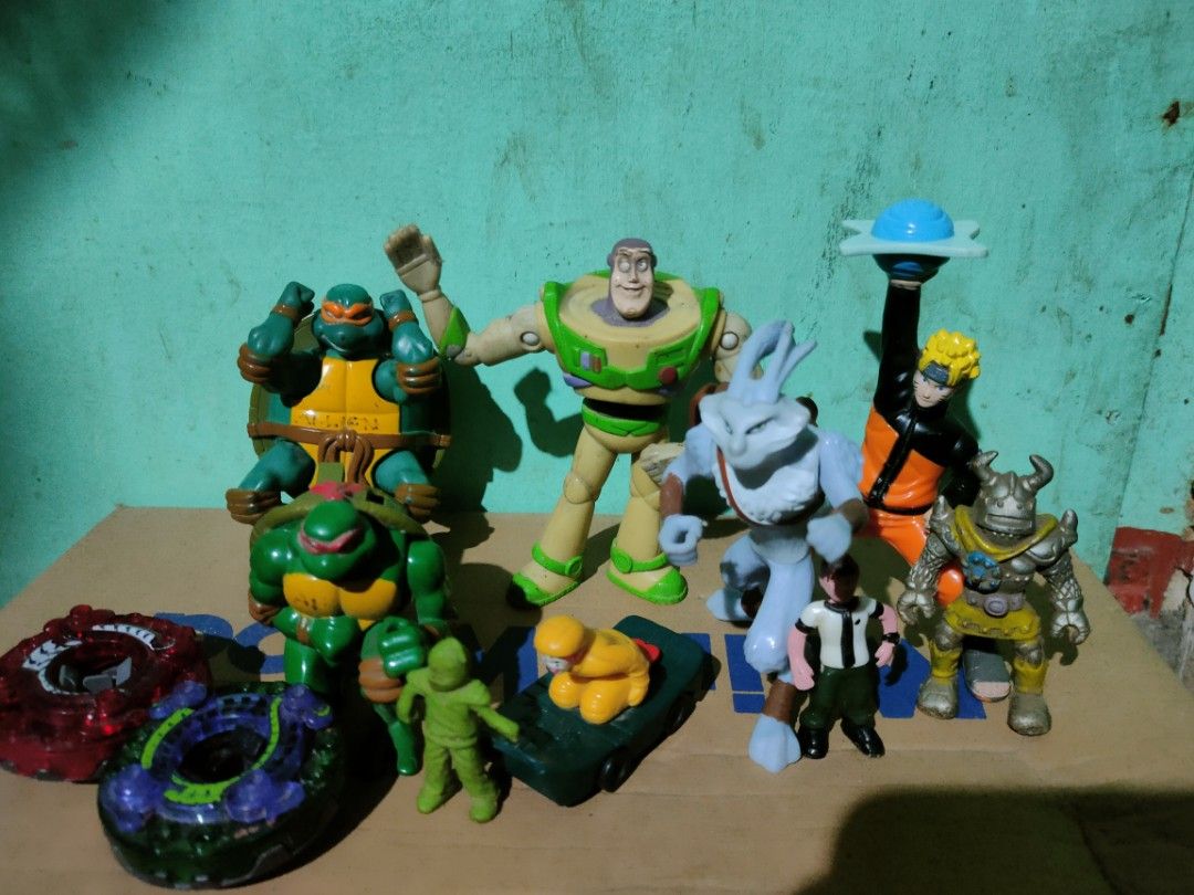 Assorted Action Figures and Toys Lot (Category: Action & Battle Toys) located in Pasig City. Submitted by laruannijearly (Listing ID 1466306967, Image 1). Description: - Bundle of mixed action figures and toys - Includes Buzz Lightyear, Teenage Mutant Ninja Turtles, Naruto, Ben 10, Beyblades, and more - Shows minor paint wear and scuffs from regular play - Perfect for collectors or kids' playtime - Sold strictly as a complete set (no tingi/separa