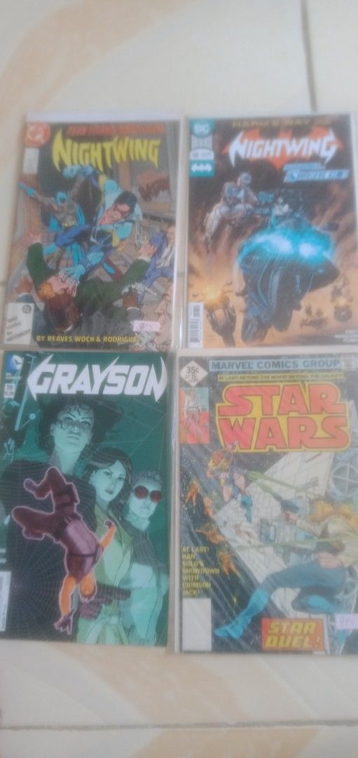 Assorted DC and Marvel Comic Book Bundle (Category: Comics & Manga) located in Caloocan City. Submitted by teamgoodbuys (Listing ID 1466161852, Image 1). Description: - Lot of 32 comic books featuring DC and Marvel - Includes: Nightwing Spotlight, Nightwing #117, Grayson #19, and Star Wars #15 - All comics are bagged and boarded for maximum protection - Perfect bundle for collectors looking to bulk up their stash - Sold as a set only.