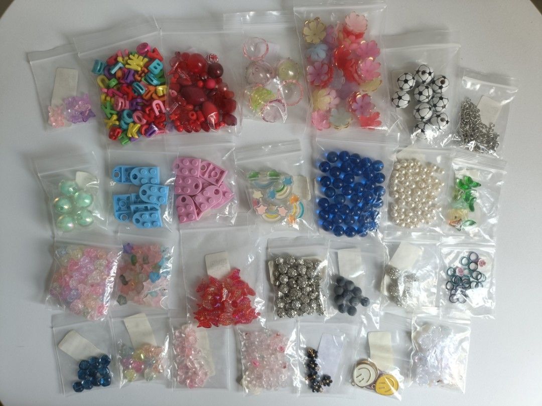 Assorted DIY Craft Beads and Charms Set (Category: Craft Supplies & Tools) located in Tanza. Submitted by misumei (Listing ID 1466328042, Image 2). Description: - Includes letter beads, pearls, resin flowers, stars, smiley charms, jump rings, and Lego-shaped pieces - Ideal for jewelry making, friendship bracelets, and phone charms ***original price more than 500 pesos. what you see in the photo is what you get MOP: Gcash | Mari Bank | BDO MOD: Pi