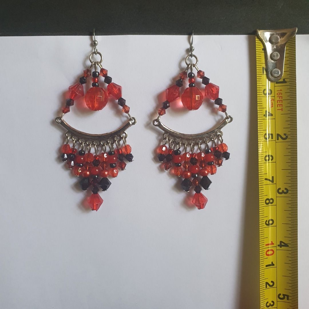 Assorted Handmade Dangle Earrings Bundle - 5 Pairs (Category: Earrings) located in Caloocan City. Submitted by mma_222 (Listing ID 1466193176, Image 2). Description: Bundle of 5 pairs of dangle earrings. Styles include amber-toned faceted cubes, vibrant red and black bead chandeliers, blue and yellow multi-strand beads, shell loops with amber accents, and dark chain drops with white pearls. Hook backings on all pairs. Lengths range around 2 to 4 