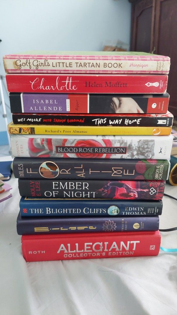 Assorted YA and Fiction Novels Lot (Category: Storybooks) located in Galimuyod. Submitted by royalforest.76e82f (Listing ID 1466269957, Image 1). Description: - Bundle of 11 diverse books (paperback and hardcover) - Titles include: Allegiant Collector's Edition, The Blighted Cliffs, Mirage, Ember of Night, Blood Rose Rebellion, Richard's Poor Almanac, This Way Home, Ripper, Charlotte,For All Time, and Golf Girl's Little Tartan Book - Genres: Youn