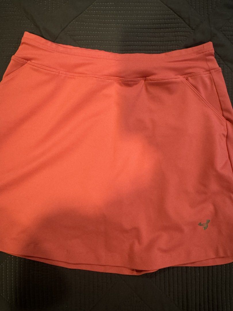 Athletic Skort Coral Pink Size M (Category: Skirts) located in Muntinlupa City. Submitted by myabcshop (Listing ID 1466284951, Image 1). Description: - Color: Coral pink - Size: Medium - Features built-in shorts underneath for extra coverage - Convenient side pockets for essentials - Crafted from comfortable, stretchy fabric designed in Singapore - Detailed with subtle logo branding near the hem - Versatile activewear ideal for running, tennis, o