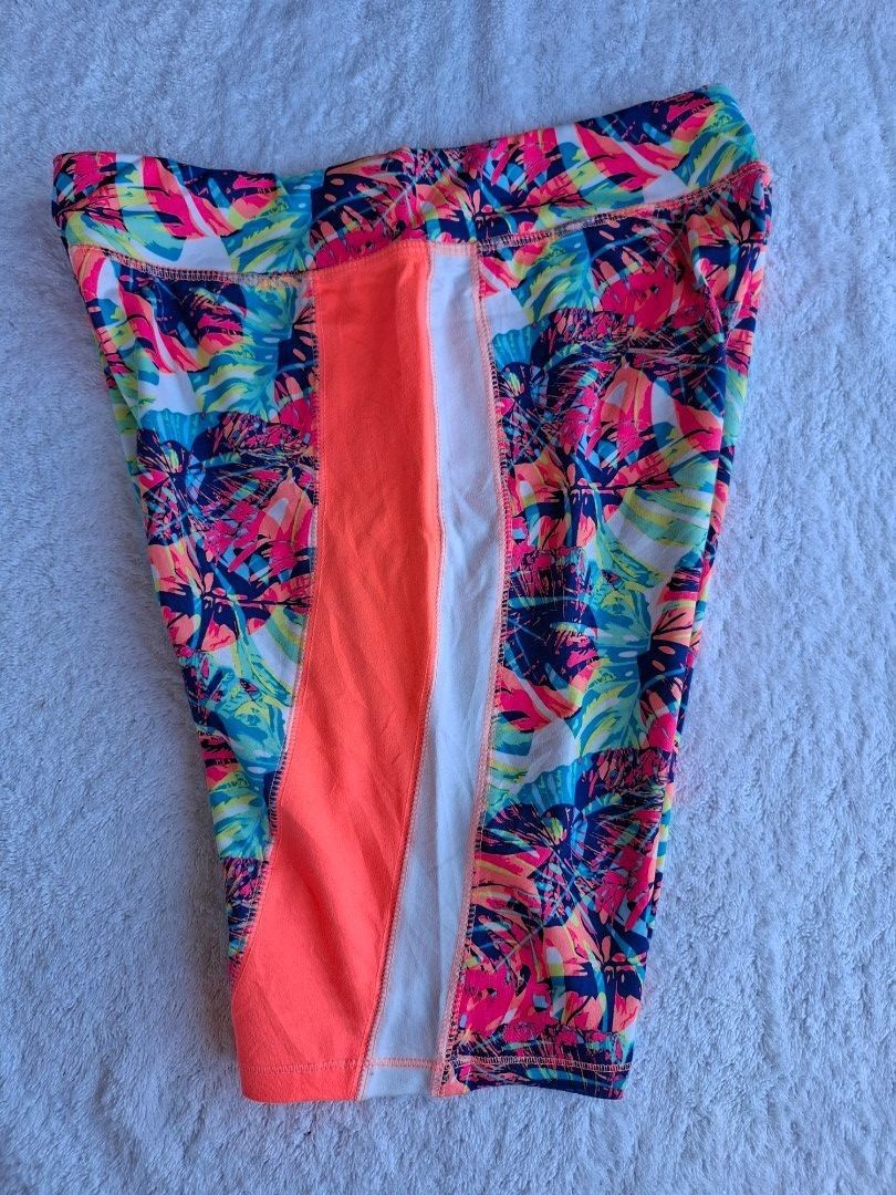 ATHLETIC WORKS BIKE SHORT (Category: Activewear) located in Abucay. Submitted by petiteprettyboutiquev2 (Listing ID 1466181947, Image 3). Description: Vibrant neon tropical print athletic bike shorts feature a colorful leaf pattern with contrasting bright orange side panels. XL in size but fits well M +SF(J&T).