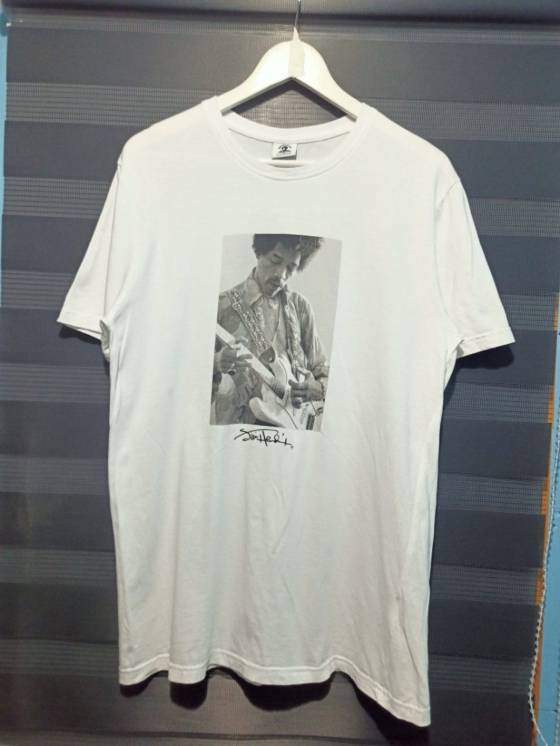 Authentic Hendrix Youre Experienced White T-Shirt Medium (Category: Tshirts & Polo Shirts ) located in Manila. Submitted by thecomftrift.co (Listing ID 1466324577, Image 1). Description: - Item: Authentic Jimi Hendrix graphic tee - Color: White - Size: Medium - Design: B&W guitar photo with signature on front; arched 'Are You Experienced' text on back - Material: Clean cotton - Condition: Excellent, minor storage wrinkles, ready to wear.
