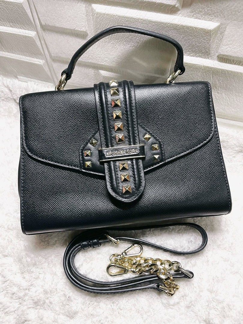AUTHENTIC MICHAEL KORS BAG (Category: Cross-body Bags) located in Quezon City. Submitted by chndriaaa (Listing ID 1466314846, Image 1). Description: Good condition. Spacious interior with adjustable/removable strap. Classy black design with gold-tone studs and hardware. Note: MK metal tag/logo plate has been transferred to another bag (not included). Selling as is. Please refer to photos for details. 📍QC.