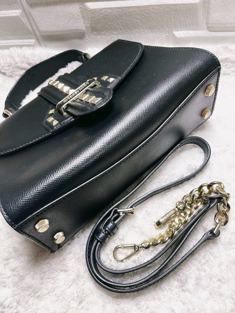 AUTHENTIC MICHAEL KORS BAG (Category: Cross-body Bags) located in Quezon City. Submitted by chndriaaa (Listing ID 1466314846, Image 2). Description: Good condition. Spacious interior with adjustable/removable strap. Classy black design with gold-tone studs and hardware. Note: MK metal tag/logo plate has been transferred to another bag (not included). Selling as is. Please refer to photos for details. 📍QC.