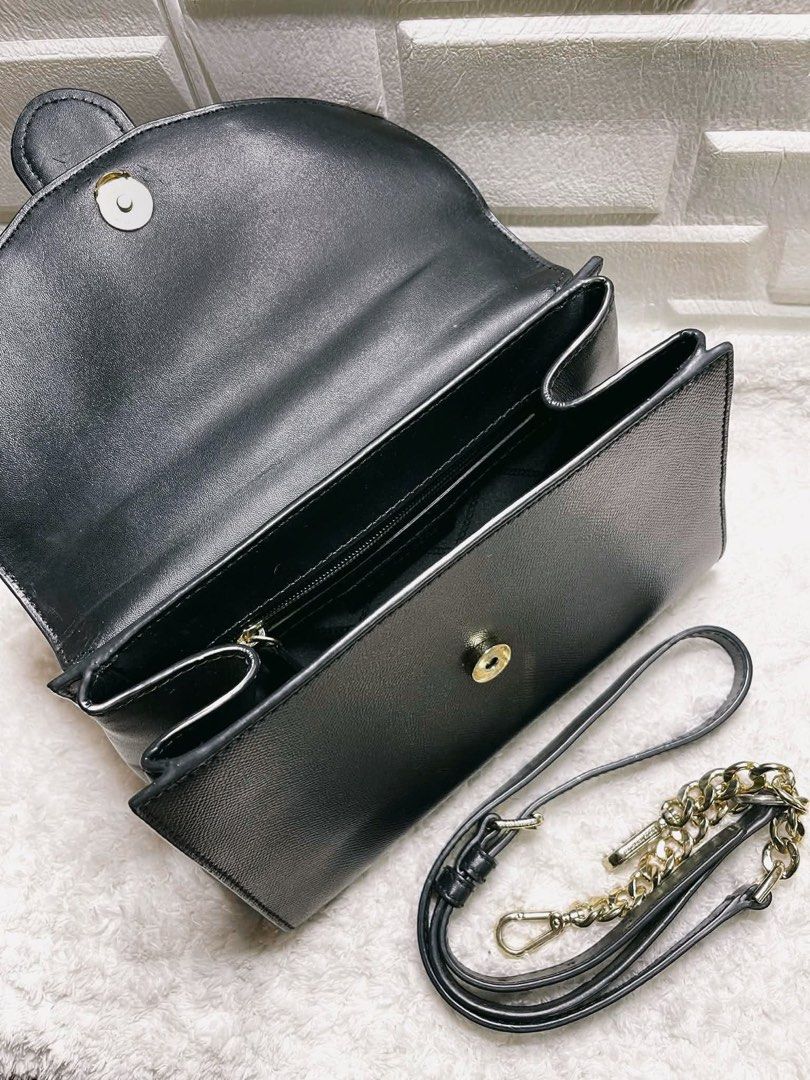 AUTHENTIC MICHAEL KORS BAG (Category: Cross-body Bags) located in Quezon City. Submitted by chndriaaa (Listing ID 1466314846, Image 3). Description: Good condition. Spacious interior with adjustable/removable strap. Classy black design with gold-tone studs and hardware. Note: MK metal tag/logo plate has been transferred to another bag (not included). Selling as is. Please refer to photos for details. 📍QC.