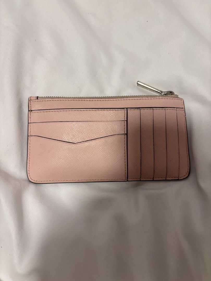 Authentic Pink Kate Spade Wallet (Category: Wallets & Card holders) located in Muntinlupa City. Submitted by shigglegitter27 (Listing ID 1466267171, Image 2). Description: Authentic Kate Spade Pink wallet!! In almost new condition, fits many cards and is lightweight :).
