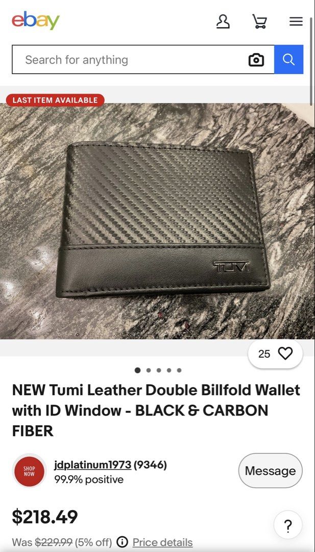 Authentic TUMI Carbon Double Billfold Wallet (Category: Wallets & Card Holders) located in Pasig City. Submitted by jjjj0987 (Listing ID 1466193546, Image 2). Description: A sleek and compact TUMI double billfold wallet featuring a textured carbon-fiber-style exterior with a smooth leather trim and signature TUMI metal logo. Interior has multiple card slots and two separate bill compartments, making it practical while still slim enough for everyd