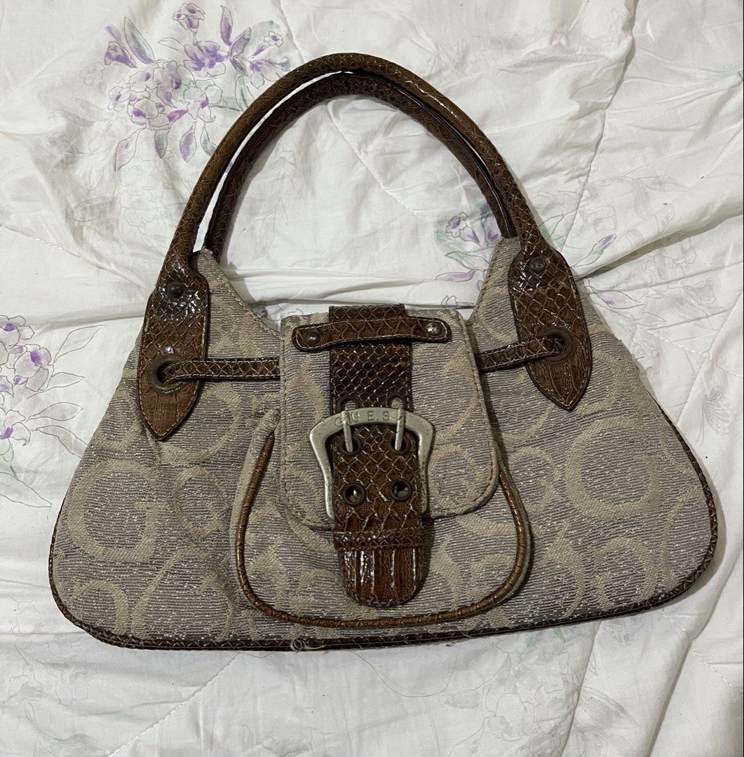 Y2K Authentic Vintage GUESS monogram shoulder brown bag (Category: Shoulder Bags) located in Angeles City. Submitted by melloromi (Listing ID 1466266283, Image 1). Description: Condition: Used with signs of wear. Please see all photos for the actual condition. -Some discoloration on the inner lining -Minor scratches/scuffs and signs of use on the exterior -Magnet closure shows signs of tarnishing -Some loose/frayed threads -Interior zipper issue 