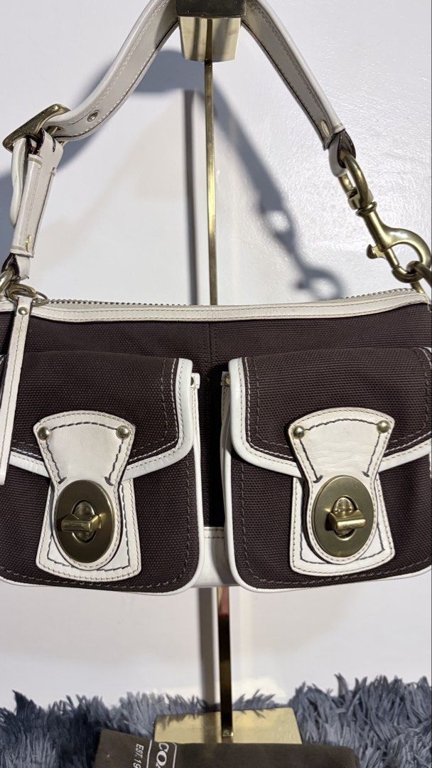 Authentic vintage coach legacy rare (Category: Shoulder Bags) located in Marilao. Submitted by vintagechic.curated (Listing ID 1466267250, Image 2). Description: 𝗖💋𝗮𝗰𝗵 Legacy 65th Anniversary Legacy Signature Canvas double front turn-lock pockets jn chocobrown. Condition: 10/10 (excellent/no issue) DM TO PURCHASE✨ 𝘋𝘪𝘴𝘤𝘭𝘢𝘪𝘮𝘦𝘳: 𝘗𝘳𝘦-𝘭𝘰𝘷𝘦𝘥 & 𝘷𝘪𝘯𝘵𝘢𝘨𝘦 – 𝘦𝘹𝘱𝘦𝘤𝘵 𝘮𝘪𝘯𝘪𝘮𝘢𝘭 𝘴𝘪𝘨𝘯𝘴 𝘰𝘧 𝘶𝘴𝘦. 𝘝𝘪𝘯𝘵𝘢𝘨𝘦𝘤𝘩