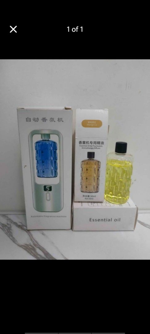 Automatic Fragrance Machine with Essential Oil (Category: Fragrance & Deodorants) located in Manila. Submitted by billythekid05 (Listing ID 1466280008, Image 1). Description: - Automatic fragrance diffuser with a convenient digital display panel - Keeps your living room, bedroom, or bathroom smelling fresh on a schedule - Package includes the main diffuser unit in its box - Comes with a separate box of essential oil including a 50ml bottle - Comp