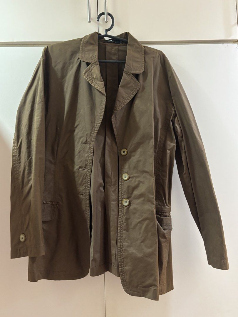 AVA Woman Brown Button-Up Long Coat Jacket (Category: Coats, Jackets and Outerwear) located in Las Pinas. Submitted by misg0905 (Listing ID 1466248696, Image 1). Description: - Brand: AVA Woman - Color: Neutral brown - Closure: Front button-up with matching round buttons - Features: Standard lapels, long sleeves, and two functional front pockets - Fabric: Lightweight, ideal for layering - Versatility: Perfect for both casual days and office wear 