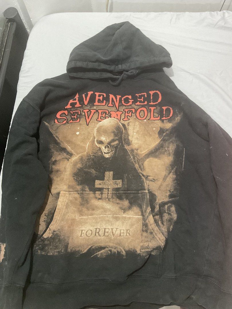 Avenged Sevenfold Hoodie XL (Category: Hoodies) located in Santa Rosa. Submitted by declr_wid_me (Listing ID 1466241271, Image 1). Description: - Brand: Avenged Sevenfold - Style: Pullover hoodie with adjustable drawstrings and front kangaroo pocket - Size: XL - Color: Black - Material: Heavy cotton blend for warmth and durability .