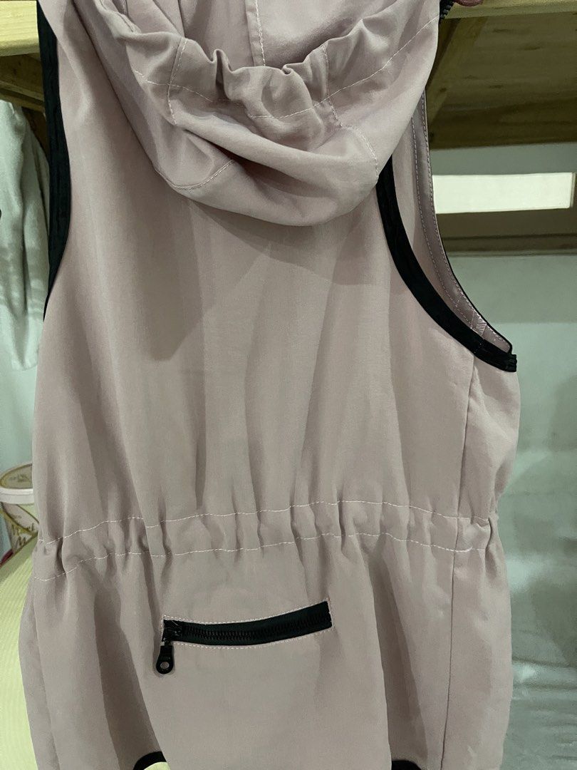 AYO Pink Hooded Vest with Drawstring Waist (Category: Coats, Jackets and Outerwear) located in Manila. Submitted by mariel1124 (Listing ID 1466244513, Image 2). Description: - Brand: AYO - Color: Dusty pink with grey and white floral vertical stripes - Closure: Full front zip with black trim - Fit: Adjustable drawstrings at both the hood and waist - Features: Sleeveless design, perfect for layering, and a small zippered pocket at the lower back -