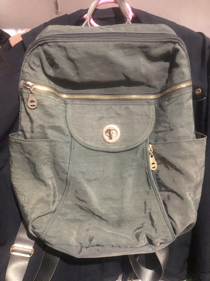 Baggallini Green Nylon Backpack with Twist Lock (Category: Backpacks) located in Manila. Submitted by rshay (Listing ID 1466282198, Image 1). Description: - Brand: Baggallini - Material: Sturdy, easy-to-wipe-clean green nylon - Pockets: Front twist-lock pocket, front zip pocket, and dual side slip pockets - Interior: Stylish grey patterned lining - Straps: Adjustable black back straps - Versatile use: Great for daily commuting, school, or travel.