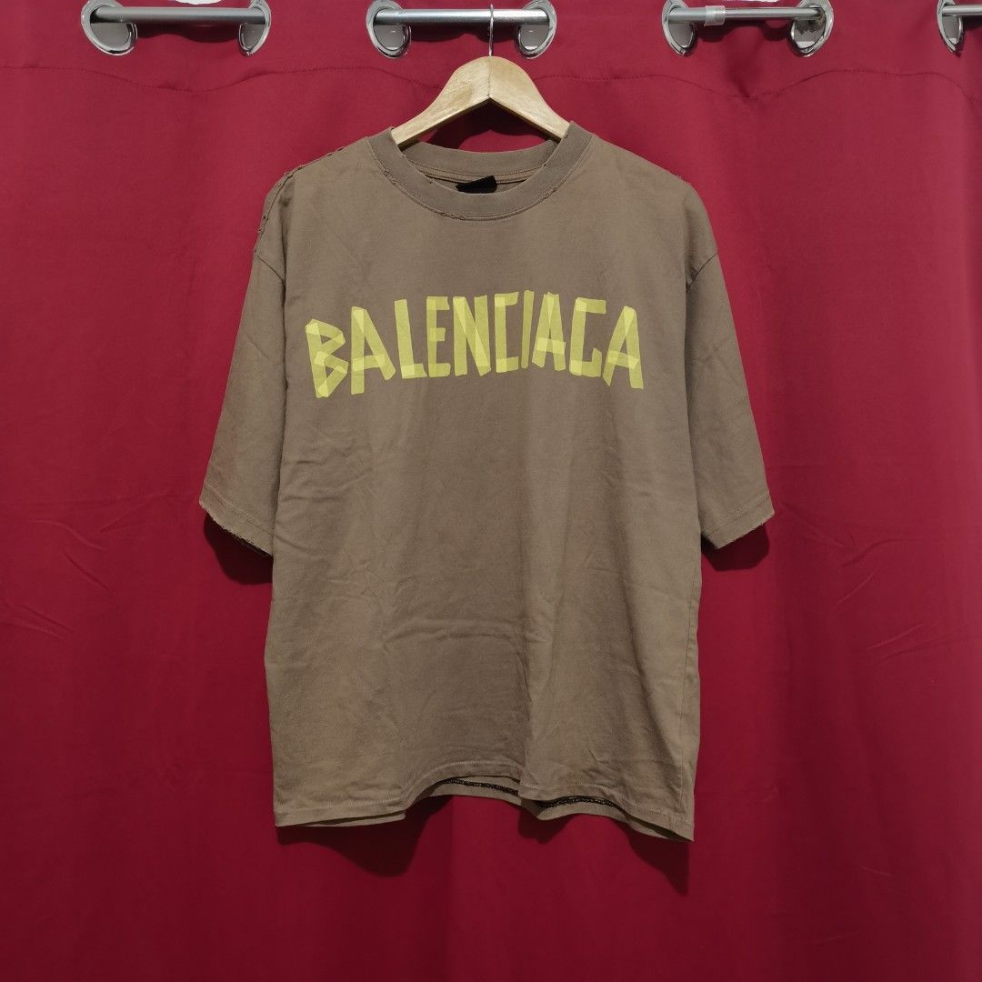 Balenciaga Distressed Shirt (Category: Tshirts & Polo Shirts ) located in Bulacan. Submitted by retrorags.ph (Listing ID 1466186852, Image 2). Description: Size: S Width: 23 Length: 27.5 Condition Rate: 9/10 Color Rate: 9/10 Issue: none **Color may vary due lighting **Item is thrifted/preloved, please manage your expectations **For more photos and inquiries, please dm us.