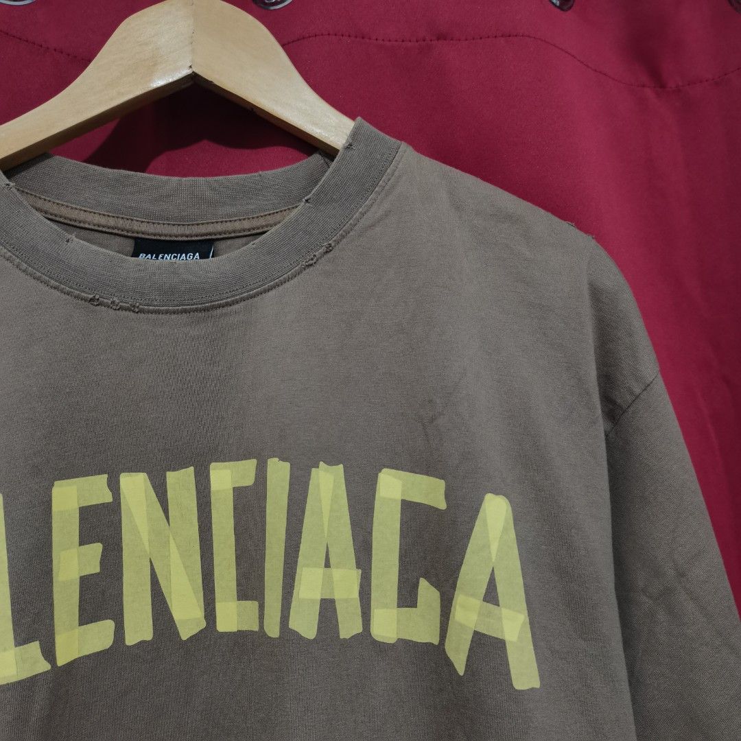 Balenciaga Distressed Shirt (Category: Tshirts & Polo Shirts ) located in Bulacan. Submitted by retrorags.ph (Listing ID 1466186852, Image 3). Description: Size: S Width: 23 Length: 27.5 Condition Rate: 9/10 Color Rate: 9/10 Issue: none **Color may vary due lighting **Item is thrifted/preloved, please manage your expectations **For more photos and inquiries, please dm us.