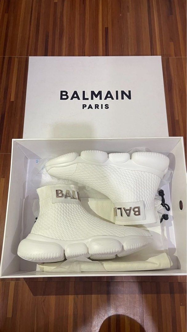 Balmain B-Runner White Sock Sneakers (Category: Sneakers & Footwear) located in Malabon City. Submitted by beia.policarpio (Listing ID 1466272242, Image 2). Description: - Brand: Balmain - Style: High top sock sneakers - Color: White with gold-tone logo lettering - Material: Textured knit upper with chunky sculpted rubber outsole - Condition: like new, worn once, pristine condition - Inclusions: Original box and full packaging included.