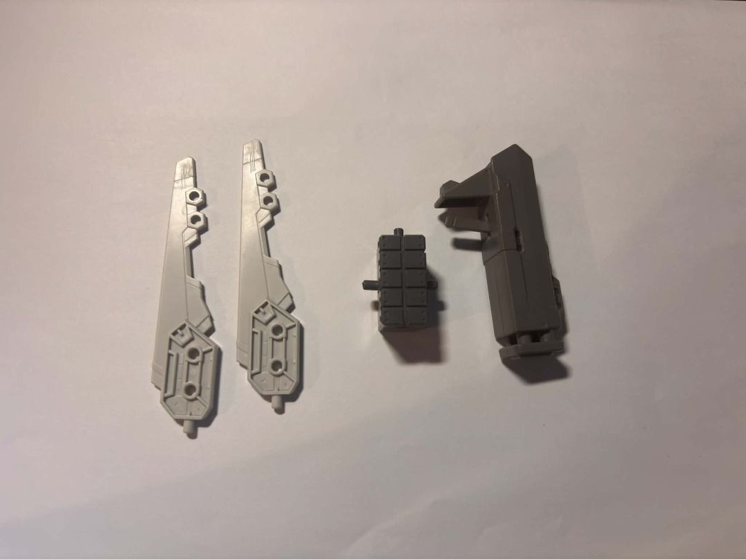 bandai gundam scraps #12 (Category: Gundam & Model Kits) located in Taguig. Submitted by livehorse.8cf1df (Listing ID 1466191779, Image 1). Description: - Lot of loose grey plastic parts for model kits - Includes 2 grey side panels, 1 small rectangular block, and 1 larger housing component - Clean, unpainted plastic salvaged from a building project - Ideal for custom builds, kitbashing, and spare parts replenishment - Ships securely from the Phil