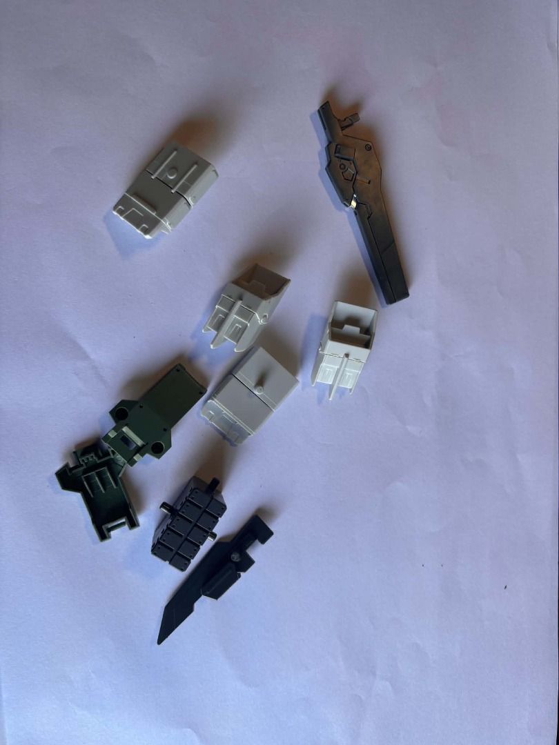 bandai gundam scraps #15 (Category: Gundam & Model Kits) located in Taguig. Submitted by livehorse.8cf1df (Listing ID 1466191503, Image 1). Description: - Gundam model kit loose plastic parts - Colors include grey, dark green, black, and white - Includes weapon components and various armor plates - Ideal for custom builds, spare pieces, or dioramas - Selling unbuilt, loose pieces exactly as pictured.