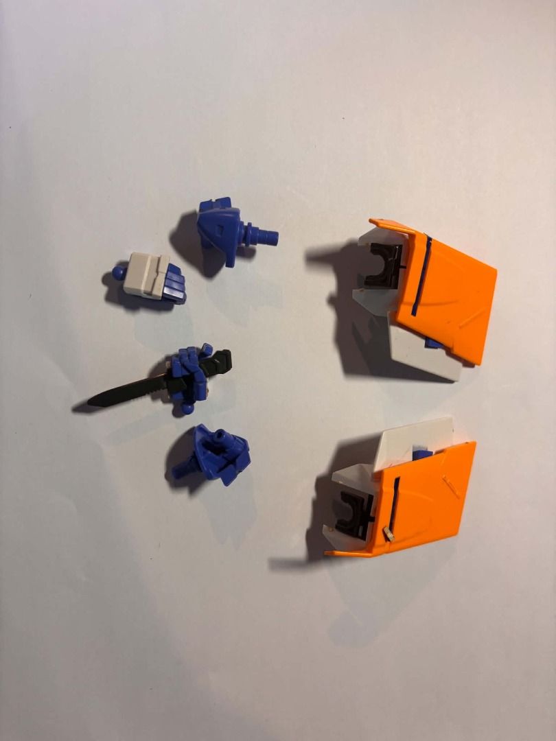 bandai gundam scraps #6 (Category: Gundam & Model Kits) located in Taguig. Submitted by livehorse.8cf1df (Listing ID 1466192489, Image 1). Description: - Model kit loose parts, ideal for custom builds or missing piece replacements - Clean molded plastic condition - Includes 2 orange armor pieces - Includes 1 hand holding a small black dagger - Includes 1 white fist - Includes a couple of blue joint connectors.