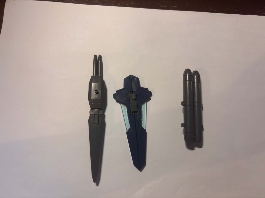 bandai gundam scraps #8 (Category: Gundam & Model Kits) located in Taguig. Submitted by livehorse.8cf1df (Listing ID 1466192348, Image 1). Description: - Set of 3 plastic model runner pieces for custom builds or spare parts - Includes dark grey rifle/bayonet attachment on the left - Features blue and dark grey shield with light blue translucent blade parts in the middle - Includes double rocket launcher or fuel tanks on the right - Brand new, str