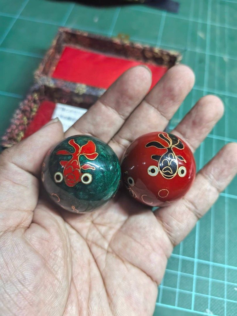Baoding BALLS - Original (Category: Other Home Decor) located in Cebu City. Submitted by dudes_villanueva (Listing ID 1466292770, Image 3). Description: Baoding BALLS - Original From Japan Auction Good as New 📌 Featuring a sun and moon design, housed in a fabric-covered brocade storage box. 📌 Key Features: • Design: Contrasting red and green spheres decorated with painted celestial motifs. • Function: Hand-held exercise and meditation tools tra