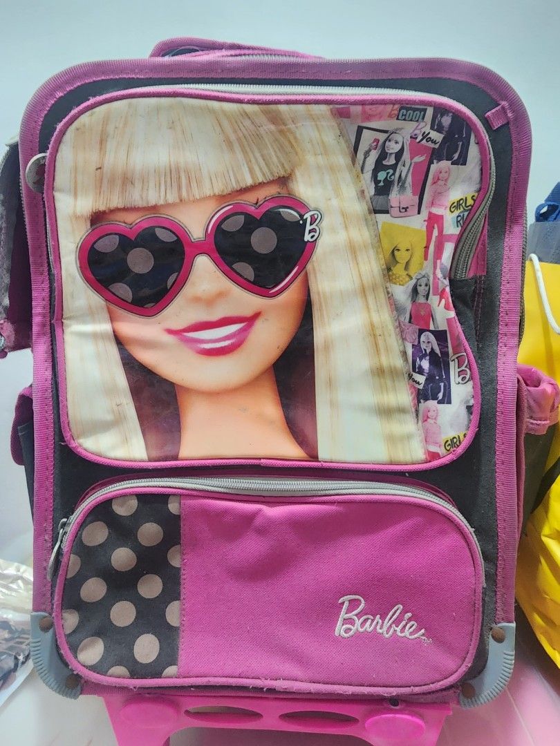 Barbie and Hello Kitty School Backpack Bundle (Category: Backpacks) located in Meycauayan. Submitted by MP_Shop (Listing ID 1466218806, Image 1). Description: - Adorable Barbie and Kitty designs in fun pink and purple color schemes - Multiple spacious compartments with secure zippered closures - Padded shoulder straps for all-day carrying comfort - Great bundle set ideal for school or casual outings - Condition: Good.