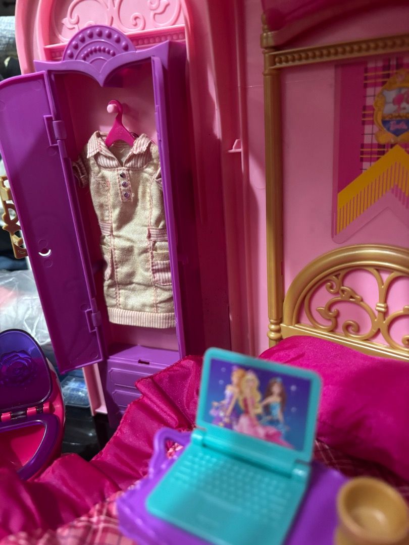 Barbie Princess Charm School Playset (Category: Kids Toys) located in Taguig. Submitted by haenessy (Listing ID 1466325126, Image 2). Description: 2011 Barbie Princess Charm School Playset with the following accessories: - Stairs - Vanity chair - Extra doll outfit - Foldable bed tray - Pillow - Pink and purple sheets - Tea set - Laptop - Curtain clips - Notebooks (2) - Blow dryer - Hairbrush - Toilet Bathtub can be rotated to form another bed. No
