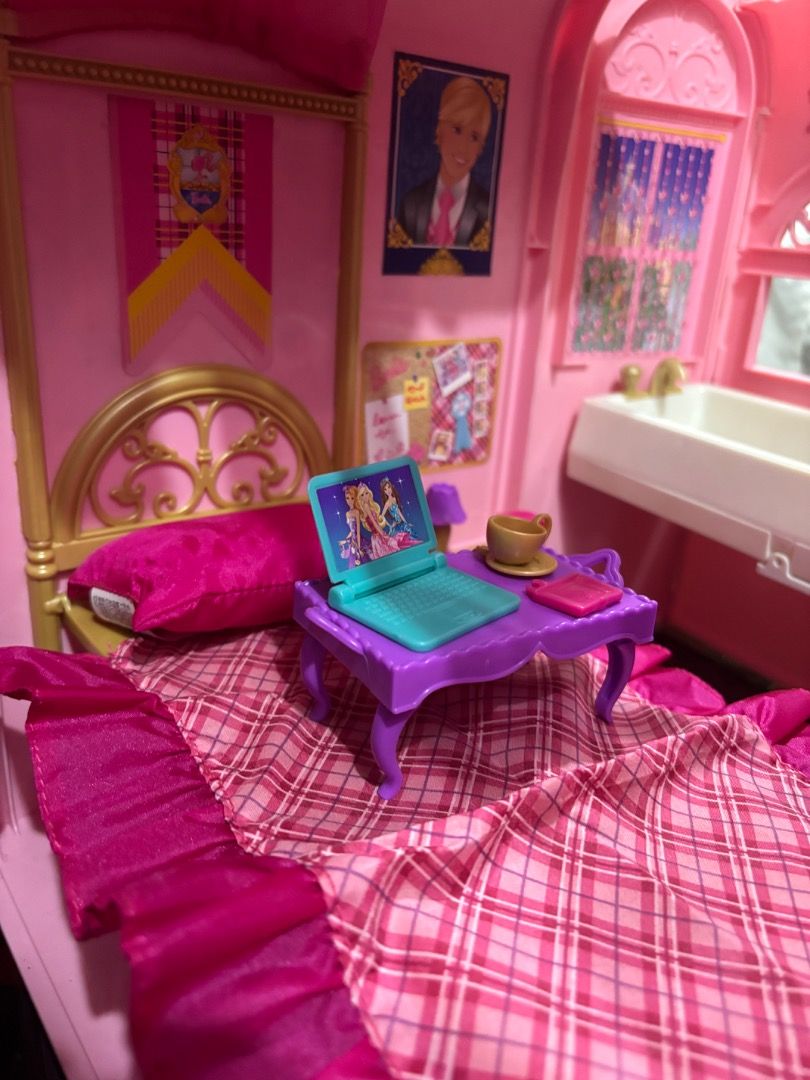 Barbie Princess Charm School Playset (Category: Kids Toys) located in Taguig. Submitted by haenessy (Listing ID 1466325126, Image 1). Description: 2011 Barbie Princess Charm School Playset with the following accessories: - Stairs - Vanity chair - Extra doll outfit - Foldable bed tray - Pillow - Pink and purple sheets - Tea set - Laptop - Curtain clips - Notebooks (2) - Blow dryer - Hairbrush - Toilet Bathtub can be rotated to form another bed. No